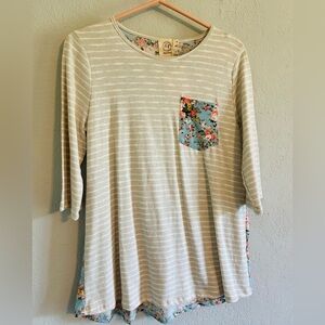 Striped top with flower front pocket and a matching flower design back
